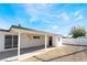 Backyard features a covered patio perfect for outdoor entertaining with graveled, low-maintenance landscaping at 5069 Hallet Dr, Las Vegas, NV 89122