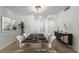 Bright dining room features a modern table setting and contemporary decor at 5069 Hallet Dr, Las Vegas, NV 89122