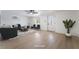 Cozy living room showcasing hardwood floors, updated furniture, and a bright entry door at 5069 Hallet Dr, Las Vegas, NV 89122