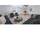 Inviting living room, light-colored walls, features contemporary furniture and ample natural light at 5069 Hallet Dr, Las Vegas, NV 89122