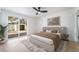 Comfortable main bedroom with sliding glass door, hardwood floors, and neutral decor at 5069 Hallet Dr, Las Vegas, NV 89122