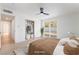 Inviting main bedroom features hardwood floors, ceiling fan, and an outdoor view at 5069 Hallet Dr, Las Vegas, NV 89122