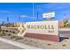 Magnolia Bay community sign featuring the builder's logo and community details at 5722 Sunset Sedona St # Lot 7, North Las Vegas, NV 89081