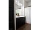 Clean and functional bathroom with a double sink vanity and a shower with a white curtain at 649 Ryan Peak Ln, Henderson, NV 89011