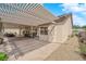 The patio is shaded by a pergola, with a full landscape in the backyard at 6781 Alpine Brooks Ave, Las Vegas, NV 89130