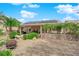 Beautiful backyard with pergola, gravel, and solar panels on the roof at 6781 Alpine Brooks Ave, Las Vegas, NV 89130