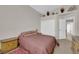 Comfortable bedroom with soft carpet, closet and access to another room at 6781 Alpine Brooks Ave, Las Vegas, NV 89130