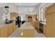 Bright kitchen with stainless steel appliances, granite countertops, wood cabinets, and a kitchen island at 6781 Alpine Brooks Ave, Las Vegas, NV 89130