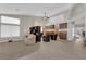 Bright and open-concept living room featuring high ceilings, stylish decor, and seamless flow at 6781 Alpine Brooks Ave, Las Vegas, NV 89130