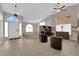 Inviting living area featuring tile flooring, a high ceiling and natural light creating a welcoming atmosphere at 6781 Alpine Brooks Ave, Las Vegas, NV 89130