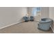 Open living room featuring a neutral palette, natural light, and seating for relaxing at 6781 Alpine Brooks Ave, Las Vegas, NV 89130