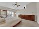 Bright main bedroom with tiled floors, large windows, and lots of drawer space at 6781 Alpine Brooks Ave, Las Vegas, NV 89130