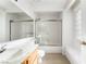 Bright bathroom featuring a large mirror and a shower over the tub at 6857 Tamarus St # 202, Las Vegas, NV 89119
