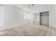 Bright bedroom with a mirrored closet and neutral carpet at 6857 Tamarus St # 202, Las Vegas, NV 89119