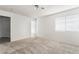 Neutral bedroom with carpet flooring and natural light from window at 6857 Tamarus St # 202, Las Vegas, NV 89119