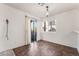 Dining room features modern lighting, tile flooring, and sliding glass doors at 6857 Tamarus St # 202, Las Vegas, NV 89119