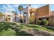 Attractive condo building showcasing colorful architectural design set amongst green lawns at 6857 Tamarus St # 202, Las Vegas, NV 89119