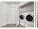 Convenient laundry room with washer, dryer, and ample shelving at 6857 Tamarus St # 202, Las Vegas, NV 89119
