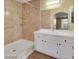 A clean and well-lit bathroom with a shower, vanity, and sink at 698 S Racetrack Rd # 412, Henderson, NV 89015