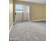 This spacious bedroom has a sliding glass door to the balcony at 698 S Racetrack Rd # 412, Henderson, NV 89015