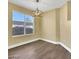 Dining area featuring hardwood floors and a bright window, perfect for intimate gatherings at 698 S Racetrack Rd # 412, Henderson, NV 89015