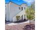 Inviting condo featuring well-maintained landscaping and a stucco facade with a staircase to the entrance at 698 S Racetrack Rd # 412, Henderson, NV 89015