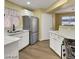 Bright kitchen with white cabinets, stainless steel appliances, and plenty of counter space at 698 S Racetrack Rd # 412, Henderson, NV 89015