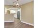 Spacious dining area with hardwood floors leading to a well-equipped kitchen at 698 S Racetrack Rd # 412, Henderson, NV 89015