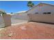 View of gated backyard, with desert landscaping and cinder block wall in a single Gathering home at 7417 Red Eagle St, Las Vegas, NV 89131