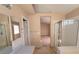Bathroom featuring a glass door shower, neutral walls, and a large vanity sink at 7417 Red Eagle St, Las Vegas, NV 89131