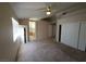 A bright bedroom offers natural lighting, carpeted floors, and an attached bathroom at 7417 Red Eagle St, Las Vegas, NV 89131
