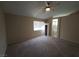 Neutral bedroom featuring carpet floors, a ceiling fan, and natural light at 7417 Red Eagle St, Las Vegas, NV 89131