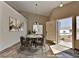 Cozy dining area with elegant decor near the front door, featuring tile floors and natural light at 7417 Red Eagle St, Las Vegas, NV 89131