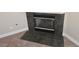 Charming fireplace with modern tile accents and hearth adding warmth to the living space at 7417 Red Eagle St, Las Vegas, NV 89131