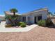 Charming single story house with well-maintained landscaping, desert rock, and an open front door at 7417 Red Eagle St, Las Vegas, NV 89131