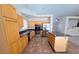 Well-equipped kitchen featuring stainless steel appliances, wooden cabinets, and a central island at 7417 Red Eagle St, Las Vegas, NV 89131