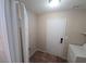 Utility room with tile floors, a laundry machine, and access to the garage at 7417 Red Eagle St, Las Vegas, NV 89131