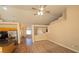Open living room and kitchen area with tile floors, neutral walls, and modern appliances at 7417 Red Eagle St, Las Vegas, NV 89131