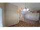 Open-concept living room with large ceiling fans, neutral-toned walls, and tile and carpet flooring at 7417 Red Eagle St, Las Vegas, NV 89131