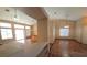 Living room featuring tile flooring, neutral paint, and views to the kitchen and sliding glass door at 7417 Red Eagle St, Las Vegas, NV 89131