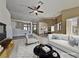 Open-concept living room with vaulted ceilings, stylish furnishings, and an abundance of natural light at 7417 Red Eagle St, Las Vegas, NV 89131
