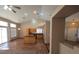 Bright living room with tile floors, natural light, and open access to the kitchen island at 7417 Red Eagle St, Las Vegas, NV 89131