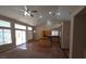 Open living area with tile floors, kitchen island, and sliding glass doors to the backyard at 7417 Red Eagle St, Las Vegas, NV 89131