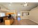 Open concept living area with tile floors, an island kitchen, and neutral walls throughout at 7417 Red Eagle St, Las Vegas, NV 89131
