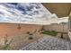 Enclosed backyard with low-maintenance landscaping, brick pavers and ample space at 7915 Pandora Sky St # 402, Las Vegas, NV 89084