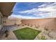 Enclosed backyard with low-maintenance landscaping, brick pavers and partial mountain view at 7915 Pandora Sky St # 402, Las Vegas, NV 89084