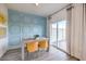 Dining area featuring a modern table, stylish chairs, and sliding glass door to the outside at 7915 Pandora Sky St # 402, Las Vegas, NV 89084