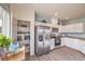 Bright kitchen with stainless steel appliances, pantry, and white cabinets at 7915 Pandora Sky St # 402, Las Vegas, NV 89084