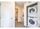 Laundry closet with stacked washer and dryer on the upper level, with easy access to bathroom at 7915 Pandora Sky St # 402, Las Vegas, NV 89084