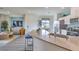 Open-concept living room featuring stylish furniture and a large window for natural light at 7915 Pandora Sky St # 402, Las Vegas, NV 89084